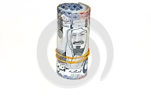 500 Five hundred Saudi Arabia money roll riyals banknotes isolated on white background, Saudi riyals cash money bills rolled up