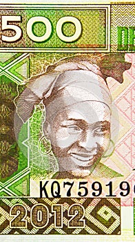 500 Francs banknote, Bank of Guinea. National currency. Fragment: Woman, Headwear