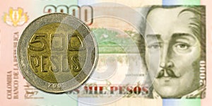 500 pesos coin against 2000 colombian peso bank note obverse