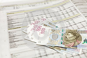 500 PLN banknotes on financial newspaper