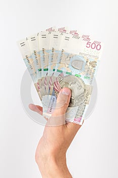 500 PLN banknotes held in hand