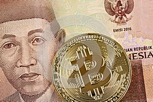 A 5000 rupiah Indonesian bank note with a golden bitcoin