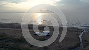 50fps aerial Sunset Couple with dog on Outdoor vacation caravan campsite camper on Melby beach, Sweden by the ocean