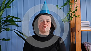 50s woman celebrating alone at home. Sad old lady feeling lonely at home. Portrait of upset old lady at house