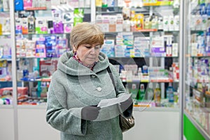 55-year-old woman buys cold medicine in  spring day