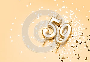 59 years celebration festive background made with golden candle in the form of number Fifty-nine