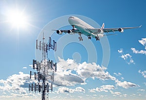 5G Cell phone or mobile service tower with aircraft approaching to land