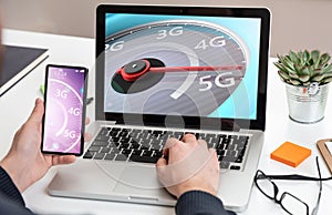 5G High speed network connection, speedometer on a computer laptop screen, business office background