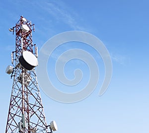 5g mobile microwave antenna or tower for telecommunications with satellite dish , blue sky background, copy space