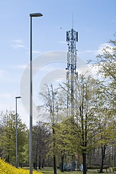 5G Network Connection Concept-5G smart cellular network antenna base station on the telecommunication mast. In a green