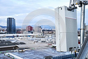 5G new radio telecommunication network antenna mounted on a metal pole providing strong signal waves