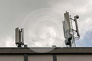 5G smart mobile phone radio network antenna base station on a telecommunications mast emitting a signal