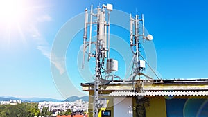 5G smart mobile telephone radio network antenna base station on the telecommunication mast radiating signal