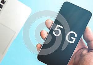 5G technology, Hand using mobile phone with 5g concept, internet on mobile smart phone and on blue