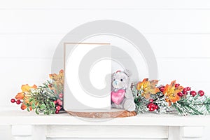 5x7 invitation mockup on a mantelpiece with autumn leaves