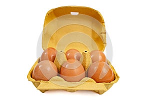 6 eggs yellow carton pack, front view isolated on white background
