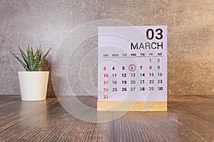 6 March on wooden grey cubes. Calendar cube date 06 March. Concept of date. Copy space for text or event.