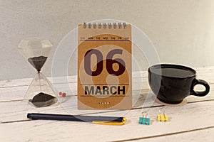 6 March on wooden grey cubes. Calendar cube date 06 March. Concept of date. Copy space for text or event.