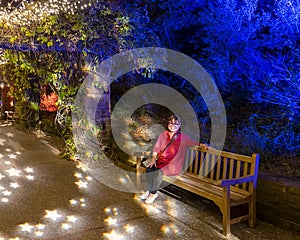 64 year-old Korean woman in the  Lightscape exhibition at the Forth Worth Botanic Garden in Texas.