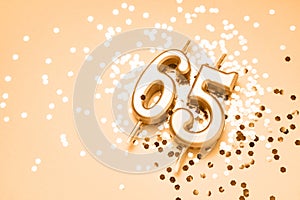 65 years celebration festive background made with golden candles in the form of number Sixty-five
