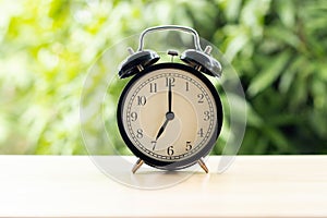 At 7 o`clock in the morning connect the time at for work with tree background