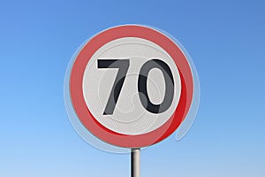 70 km/h speed limit road sign with a blue sky background