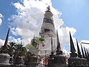 The 78m high Sri Lankan style chedi, Wat Phra Mahathat Woramahawihan is surrounded by 173 smaller ones, seen here being renovated