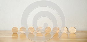 8 blank octagon wood blocks on table over white background, copy space for text