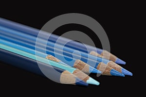 8 Blue Coloured Pencils - Black Background