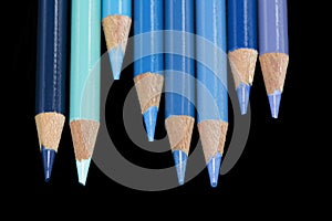 8 Blue Coloured Pencils - Black Background