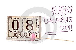 8 March sign Happy Women`s Day with wooden block calendar and pink lips on a stick