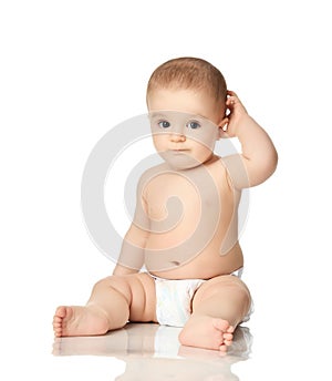 8 month infant child baby boy kid toddler sitting in diaper thinking scratch one head