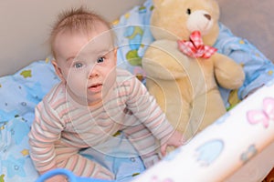 8 month old baby in playpen