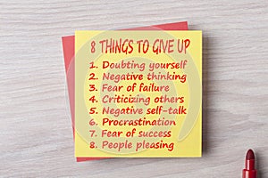 8 things to give up written on note concept