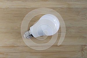 8 watt LED bulb white light on wooden