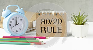 the 80 20 rule text on white paper on a table