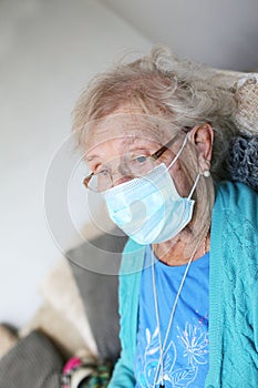 80 year old pensioner wearing a face mask for protection