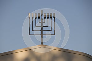 9 branch menorah on top of a synagogue