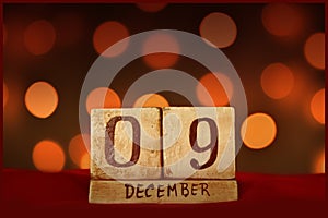 9 December vintage calendar, bokeh lights background