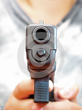 9 mm automatic hand gun holding by woman