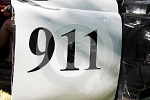 911 text on side of a police car. 911 Emergency response police car