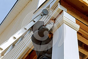 9Builders install a support column in the new home installing construction