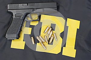 9mm handgun with ammo on fbi uniform