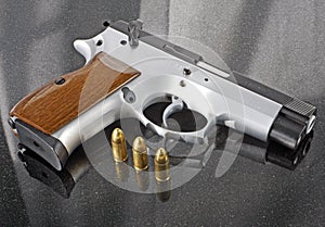 9mm handgun with bullets photo