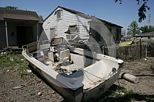 9th Ward home with boat in front yard