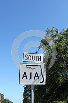An A1A highway sign along side the road.