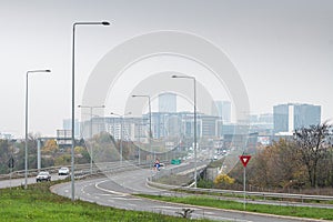 A3 highway motorway road at the entrance in the North of Bucharest city in Romania during a cloudy foggy autumn morning