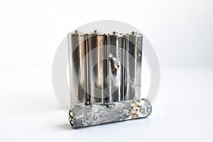 AA batteries in a stack on white