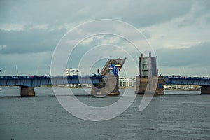 Aalborg, Denmark: Bascule bridge across the Langerak strait just opening for vessels, yacht board view