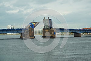 Aalborg, Denmark: Bascule bridge across the Langerak strait just opening for vessels, yacht board view